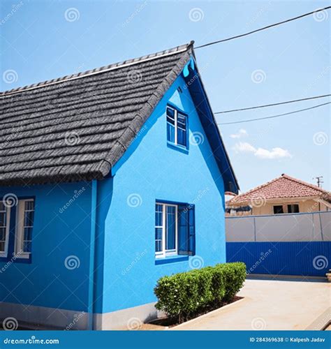 A Beautiful Blue House with White Siding and a Grey Roof. Stock ...