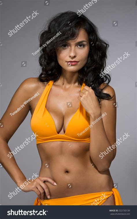 Brunette Yellow Bikini Against Gray Background Stock Photo 222735139 Shutterstock