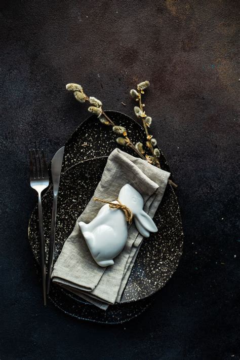 Easter Table Setting With Ornamental Rabbit And Pussy Willow Branch On Plate Premium Photo