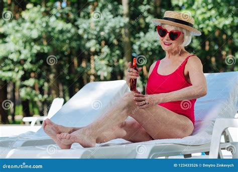 Beaming Blonde Haired Retired Woman Sunbathing On Hot Day Stock Photo Image Of Nature