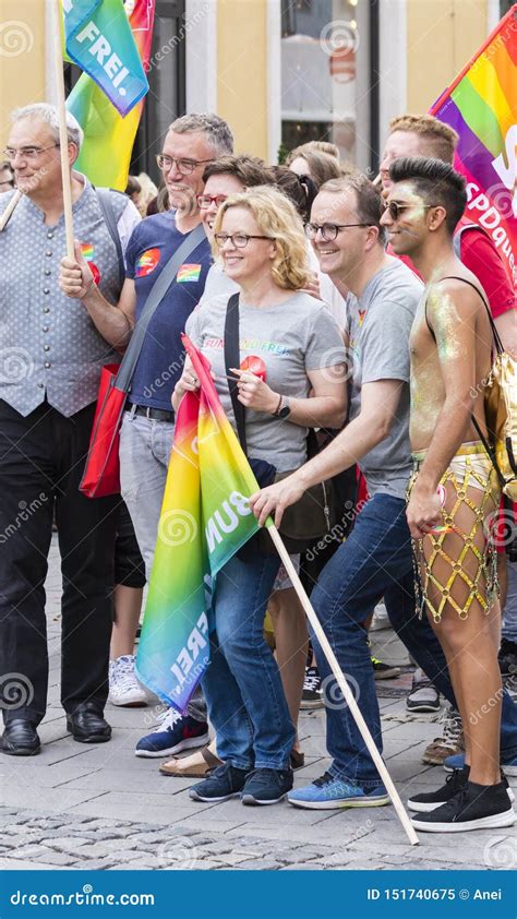 People With Rainbow Flags Attending The Gay Pride Parade Also Known As Christopher Street Day