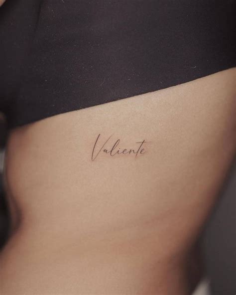 Valiente Lettering Tattoo On The Rib