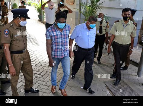 Sri Lankan Police Officials Escort Arrested Narcotics Unit Police