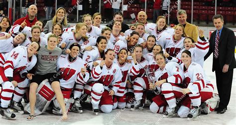 The Wisconsin Womens Hockey Team Poses With The Wcha 1st Place Trophy Greg Dixon Photo Corp