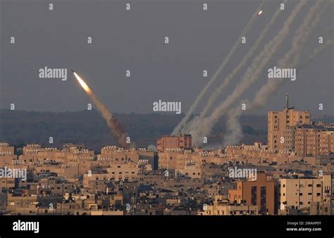 Rockets are launched from the Gaza Strip towards Israel, in Gaza City ...