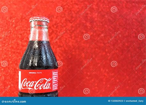 Classic Coca Cola Glass Bottle With Abstract Blur Red Sparkling