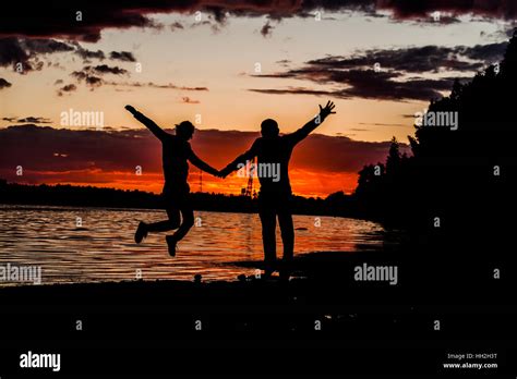 Happy Romantic Middle Aged Couple Enjoying Beautiful Sunset Walk On The