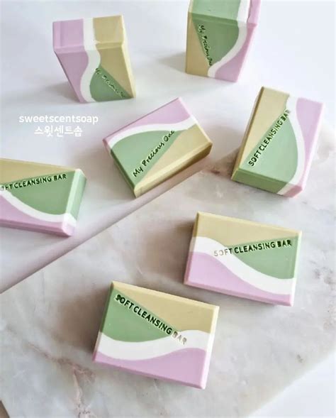 Five Pieces Of Soap Sitting On Top Of A Marble Countertop Next To Each