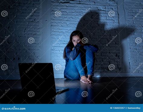 Woman Suffering Internet Cyber Bullying And Harassment Feeling Lonely Looking Afraid At Laptop