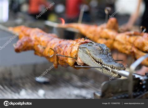 Crocodile Meat On The Barbecue For Sale To Tourists Stock Photo