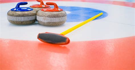 Curling equipment on ice sheet · Free Stock Photo