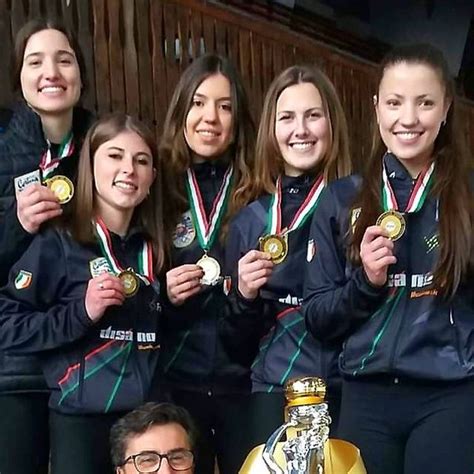 The Women S Track Team Is Posing With Their Medals