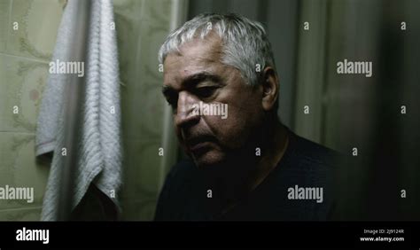 Fearful Depressed Old Man In Front Of Mirror Stock Photo Alamy