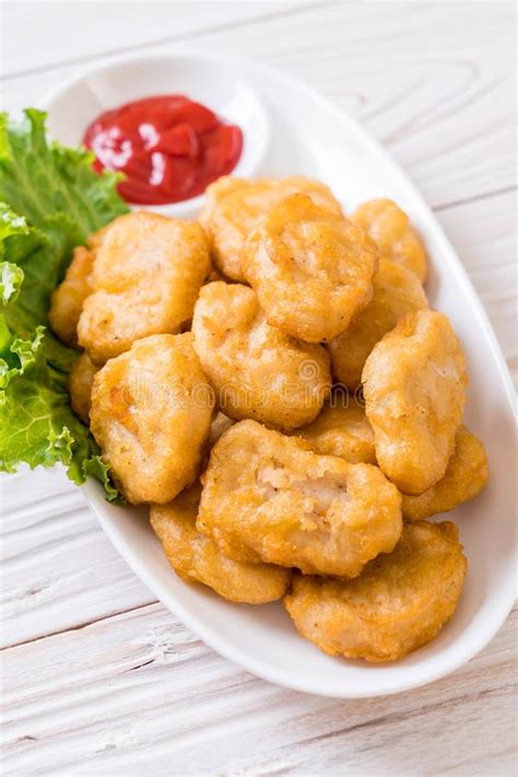 Chicken nuggets with sauce stock image. Image of isolated - 143103293