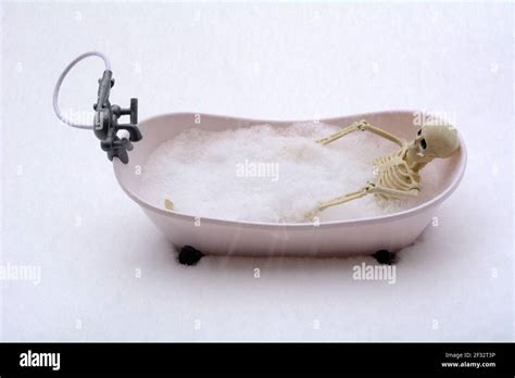 Humorous Scene Of Naked Skeleton Taking A Bubble Bath During Snow Storm Blizzard Stock Photo Alamy