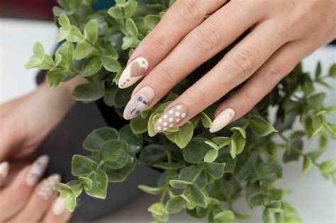 Premium Photo Manicure Drawing On The Nails Nude Nail Polish