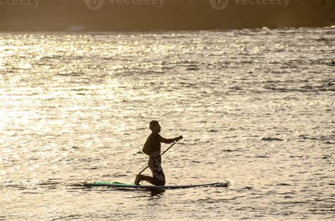 Silhouette of a surfer 22136207 Stock Photo at Vecteezy