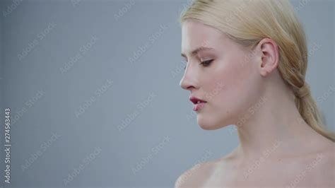 Gorgeous Profile Of Blonde Female Model With Naked Shoulders Looking Down Appealing Nude Girl