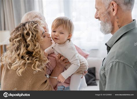 Blonde Curly Woman Kissing Daughter Visit Mature Parents Stock Photo AllaSerebrina