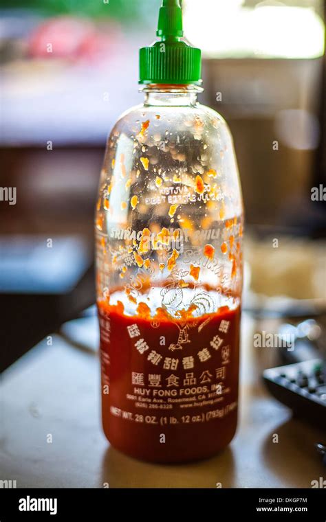 A Partially used Bottle of Sriracha chili sauce Stock Photo - Alamy