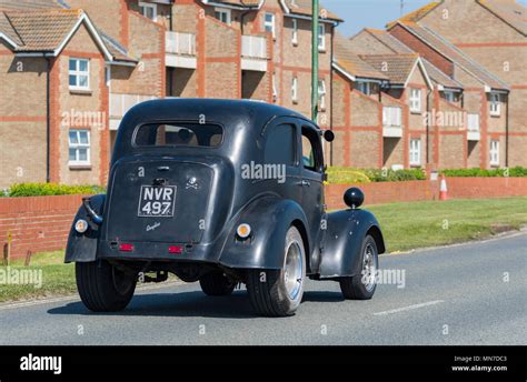 Black Vintage Ford Anglia Car From 1953 Converted To A Hot Rod In