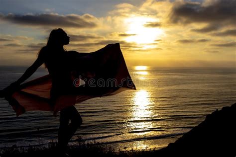 Lovely Brunette Bikini Model Relaxing On The Shoreline At Sunset Stock Image Image Of