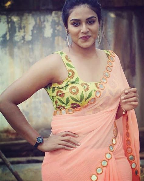 Indhuja Ravichandran Latest Hot Transparent Pink Saree And Yellow Floral Sleeveless Blouse