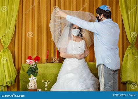 During The Chuppah Ceremony In The Synagogue The Masked Bride And