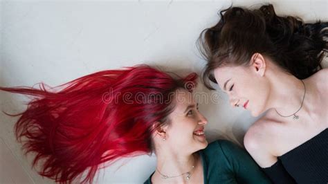 Top View Of Two Women Lying Side By Side Lesbian Intimacy Stock Photo