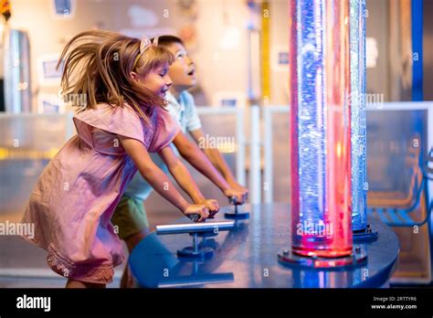 Kids playing in science museum Stock Photo - Alamy