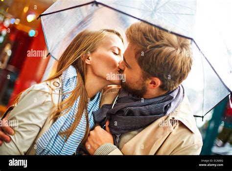 People Kissing Under Umbrella Silhouette