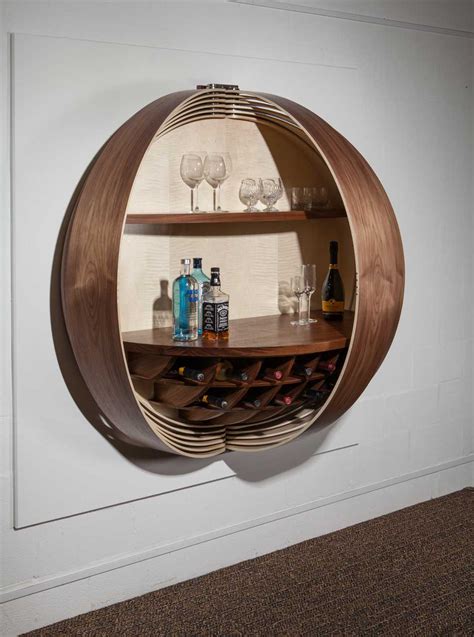 A Wall-Mounted Bar Cabinet Inspired by a Spinning Coin