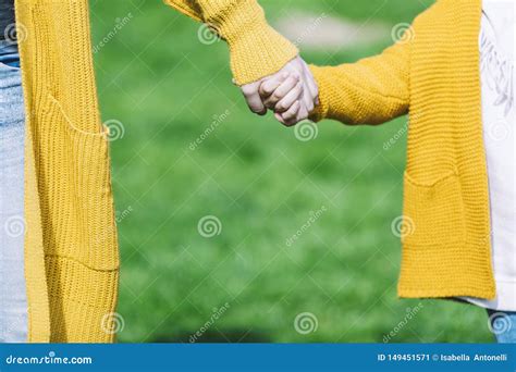 Hands Of Mother And Daughter Holding Each Other Stock Image Image Of