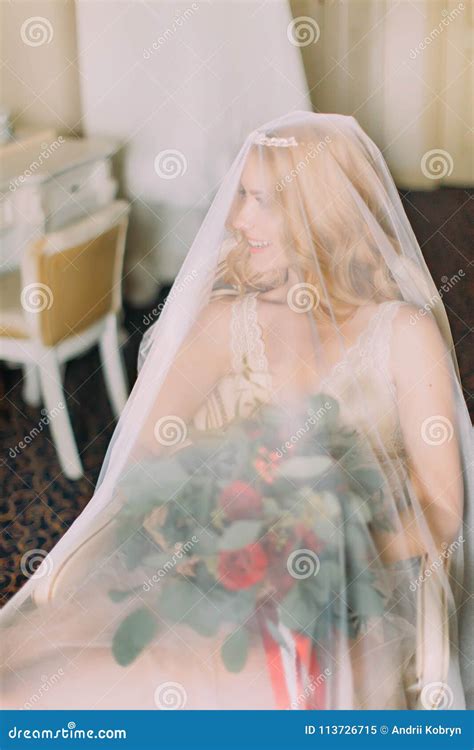 Blonde Bride Holding Bouquet Dressed In Veil And White Underwear Only Stock Image Image Of