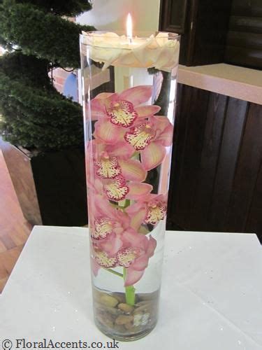 Cymbidium Orchids Or Roses Suspended Under Water With A Large