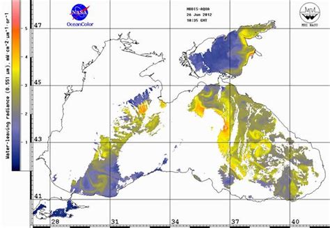 Satellite image of the Black Sea (а) and after applying the cloud mask ...