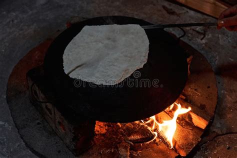 Pita Bread Baking On A Saj Or Tava On Fire Close Up Stock Image