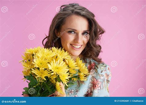 Portrait Of Smiling Trendy Woman In Floral Dress On Pink Stock Image