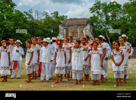 A Group Of Mayan Children Dance Group Visiting The Great Ball Court