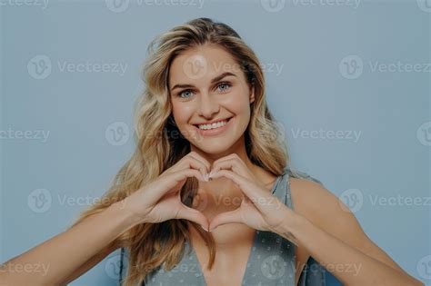 Lovely Blonde Woman Admitting In Her Love With Use Of Heart Gesture 15179596 Stock Photo At Vecteezy