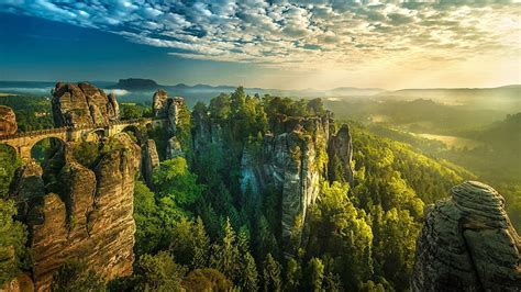 HD wallpaper: Bastei, bridge, cliff, Climbing, clouds, forest, Germany, Hill | Wallpaper Flare