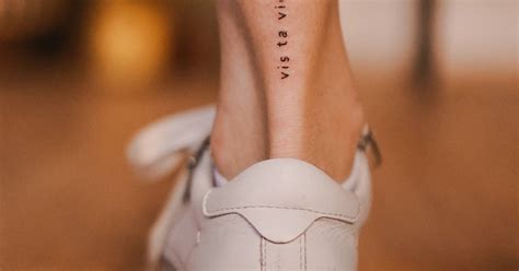 Tattoo That Says Vis Ta Vie Located On The