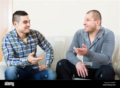 Gay Couple Relaxing On Couch Hi Res Stock Photography And Images Alamy