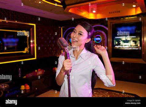 Young Woman Singing In Ktv Stock Photo Alamy