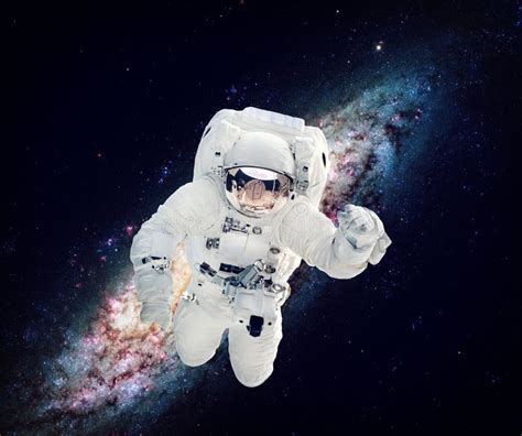 Astronaut In The Outer Space Milky Way On The Background Elements