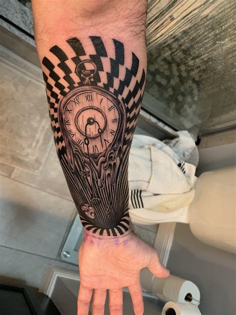 Clock being absorbed into a black hole. Done by Tye at War Kings Tattoos in Orlando, FL. : r/tattoos