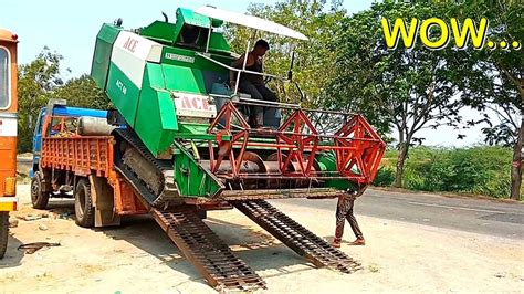 Rice Harvesting Machine Uploading In Truck By Experience Driver Village