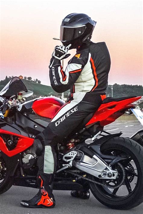 Cool Biker Wearing An Agv Pista Gp R Motorcycle Helmet On His Bmw Sport