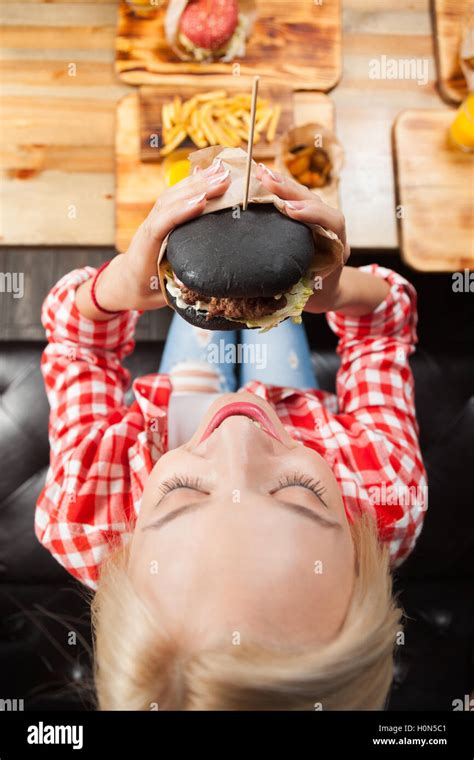 Beautiful Blonde Woman Eat Beef Burger Top Angle View Stock Photo Alamy