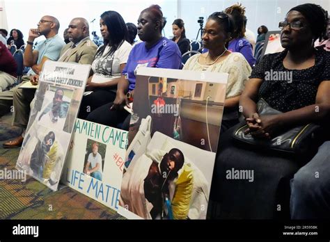 The Families Of Michael Corey Jenkins And Damien Cameron Sit Together